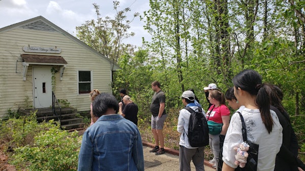 A group of students, faculty and staff visited various sites in St. Louis with Bob Hansman, as they learned more about the history of neighborhoods just a few miles from the Danforth Campus. (Credit: Janie Brennan)