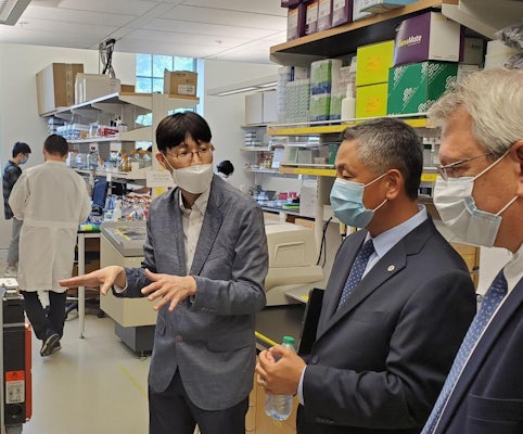 Washington University in St. Louis Professor Tae Seok Moon (left) shows his bioengineering lab to Ed Chu, EPA region 7 acting administrator (center).