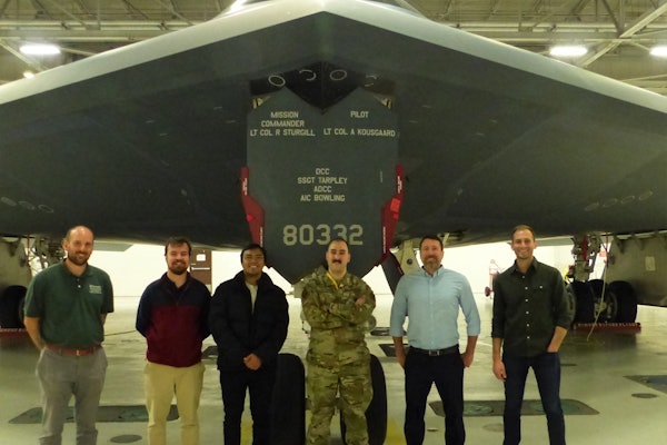 Jon Shidal (far left), lecturer and Capstone instructor, with students from the Innovating for Defense class and airmen on the visit to Whiteman Air Force Base. Courtesy of National Security Innovation Network.
