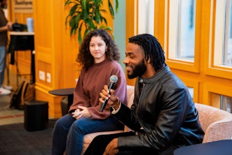 (From left) Jessie Donovan and Donovan Dixson during NSBE’s Black is Future program in February. Dixson talked with Donovan during this multidisciplinary event focused on the combination of the arts and engineering through the past and up to the present. (Credit: Tyler Small)