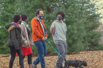 The Nussinov family — (from left) Maya, Tsitsi, Zohar and Ethan — walking their dog, Pi, in Clayton’s Oak Knoll Park. (Photo: Joe Angeles/Washington University)
