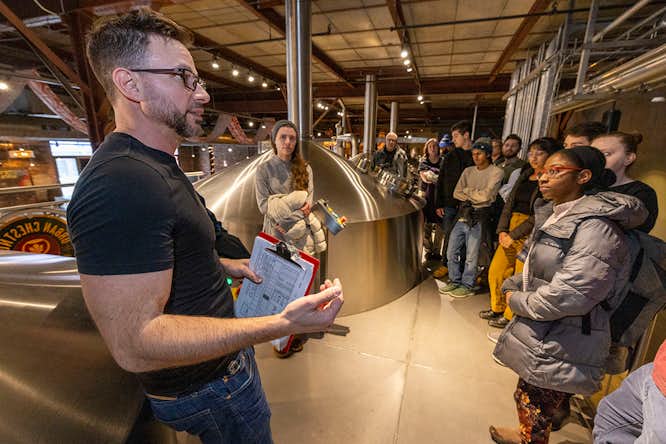 Students from McKelvey School of Engineering tour Urban Chestnut brewery and its large bioreactors. Beer is not the only product microbes will be producing in the future. Researchers from McKelvey will be developing a way to ensure fermentation is cost-competitive for making many forms of products. (Photo: Joe Angeles/WashU).