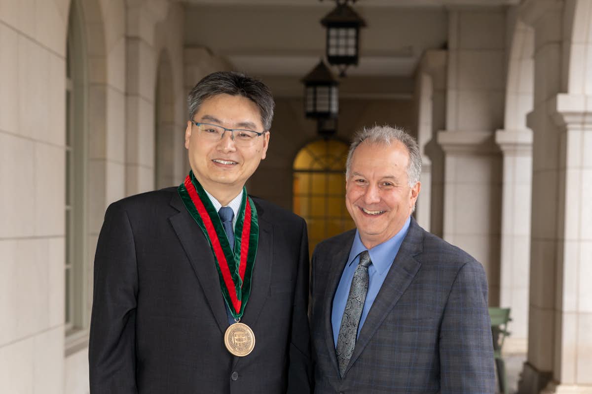Jason He and Aaron Bobick at He’s installation ceremony as the Laura and William Jens Professor of Environmental Engineering. (Photo: Jamesley Lane/Washington University)