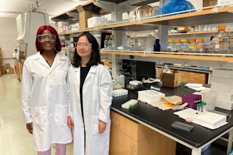 Millie Savage (left) and Hakyung Lee (right) conducted research in Yinjie Tang’s lab last summer in preparation for a late August shuttle launch from Kennedy Space Center. (Photo courtesy of Hakyung Lee)