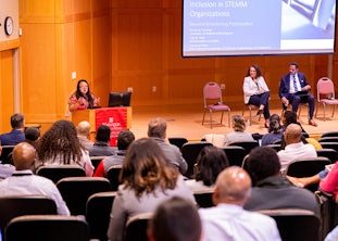 Layne Scherer, senior program officer at the National Academies of Science, Engineering, and Medicine, addressed Washington University participants at a campus event on anti-racism in STEMM. She was joined on stage by Kecia Thomas, dean of Arts and Sciences at the University of Alabama-Birmingham, and Karl Reid, senior vice provost and chief diversity officer at Northeastern University. (Photo: Sean Garcia/Washington University)