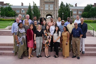 Rising BME scholars, sponsors and plenary speakers in front of Brookings Hall.