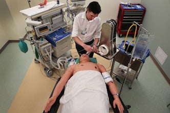 Dr. Broc Burke, who teaches and practices cardiothoracic anesthesiology at WashU, tests an emergency ventilator on a simulator mannequin in the Clinical Simulation Center at Barnes-Jewish Hospital on Friday, April 10, 2020. Photo by Robert Cohen