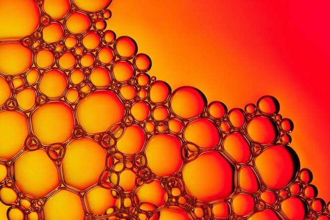 Biomolecular condensates often appear like soap bubbles but are actually more like silly putty, featuring mostly elastic and viscous behaviors on different timescales. WashU researchers have devised a method to image the internal organization within condensates to arrive at a structural explanation for condensate viscoelasticity. (Image: Shutterstock).