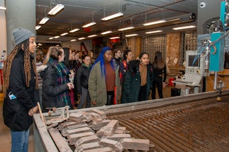 Students tour MADE STL during a February 2020 social event hosted by the Women & Engineering initiative. 
