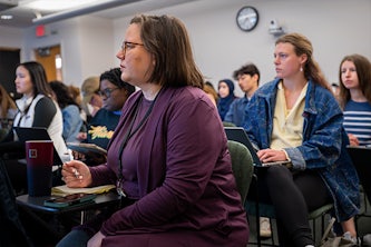 Michelle Oyen, associate professor of biomedical engineering and director of the Center for Women’s Health Engineering, listens to student presentations in Engineering for Women’s Health, a unique course she designed to teach students how they can apply their engineering skills to improve women’s health. (Credit: Sid Hastings)