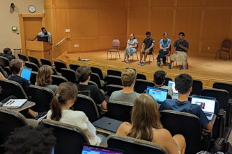 A panel of senior Engineering students speak to first-year students during the first weekly meeting of EN120. The course provides first-year students with opportunities to hear from other Engineering students, faculty and alumni.