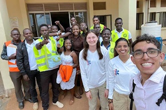 Haleigh Pine (foreground right), Amber Batra and Kyrillos Ayoub, members of LFR International, traveled to Uganda to help train more than a dozen lay instructors in basic first-aid and trauma care in an effort to build emergency response infrastructure in low- to middle-income countries. 