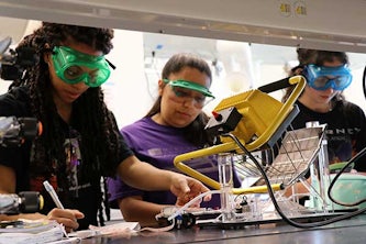  High school students use photovoltaic panels to produce fuel to power toy cars. Nearly two dozen students visited campus to learn more about thermodynamics.