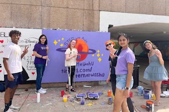 Members of oSTEM paint a mural in the South 40 overpass at a club event during the 2021-22 academic year.