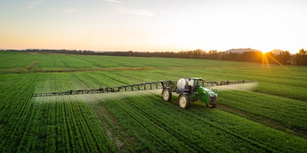 A farmer sprays pesticides on crops. New research from the lab of Kimberly Parker at the McKelvey School of Engineering shows that amines, sometimes used as an additive in herbicides, can enter the atmosphere, where they pose risks for human health and alter the atmosphere. (Photo: Shutterstock)