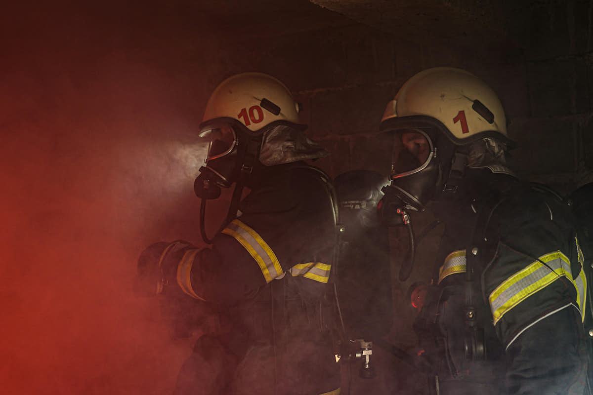 Firefighters equipped with protective gas masks navigate hazardous environments, emphasizing the importance of advanced filtration technology in ensuring safety during emergencies. (Image: Pexels)