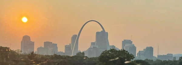 Smoke from wildfires in the western U.S. create haze in the sky over downtown St. Louis as the sun sets Thursday, July 22, 2021. A heat advisory is in effect for Saturday with heat index values up to 105 expected in the St. Louis area. (Michael Collins, mcollins@post-dispatch.com)