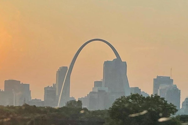 Smoke from wildfires in the western U.S. create haze in the sky over downtown St. Louis as the sun sets Thursday, July 22, 2021. A heat advisory is in effect for Saturday with heat index values up to 105 expected in the St. Louis area. (Michael Collins, mcollins@post-dispatch.com)